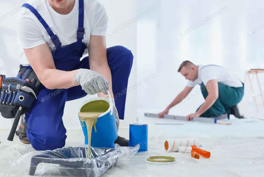 two men mixing paint