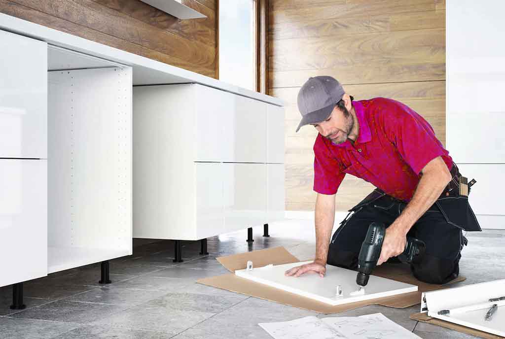 man renovating kitchen